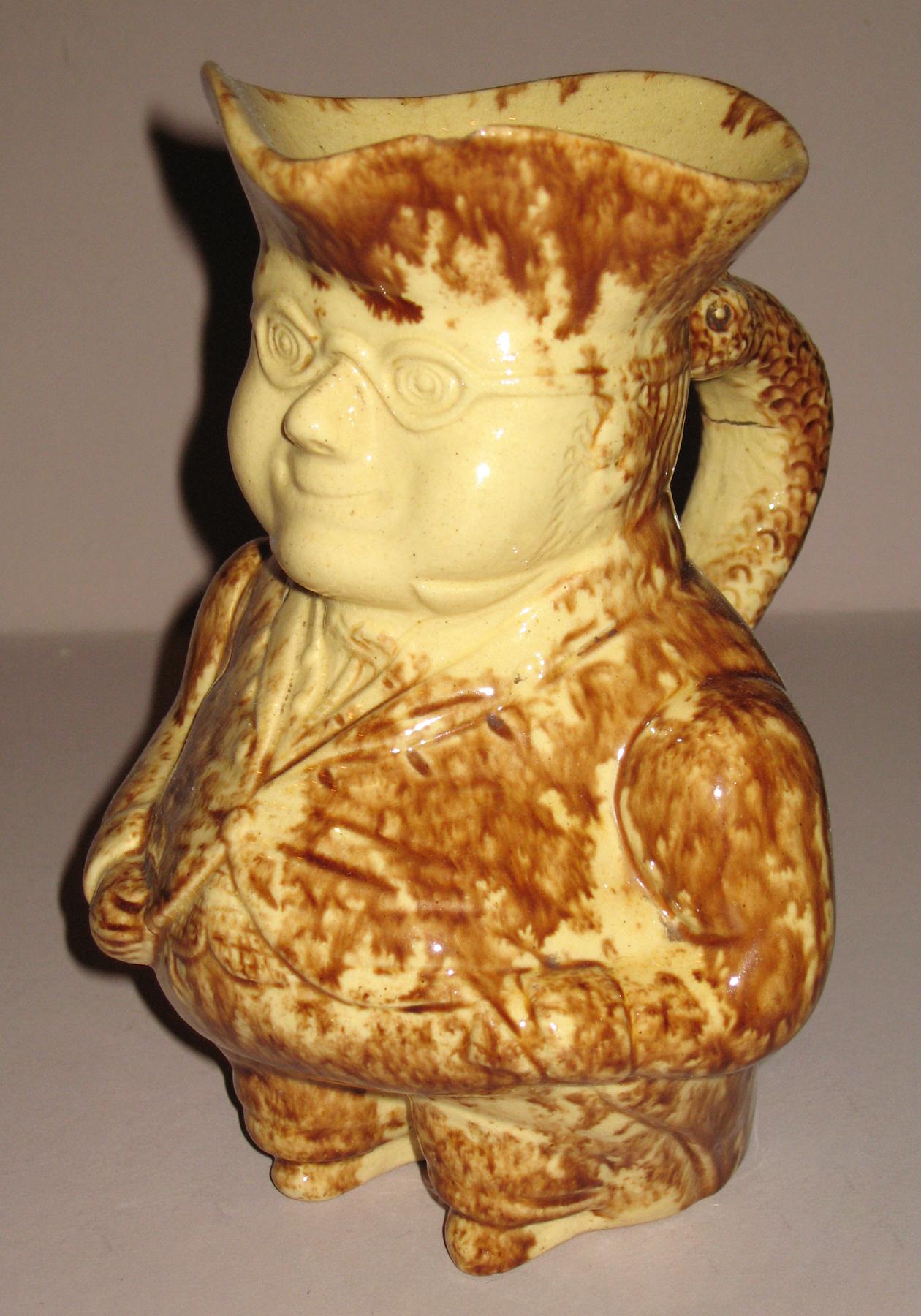 1967.1644 Earthenware man shaped jug or pitcher
