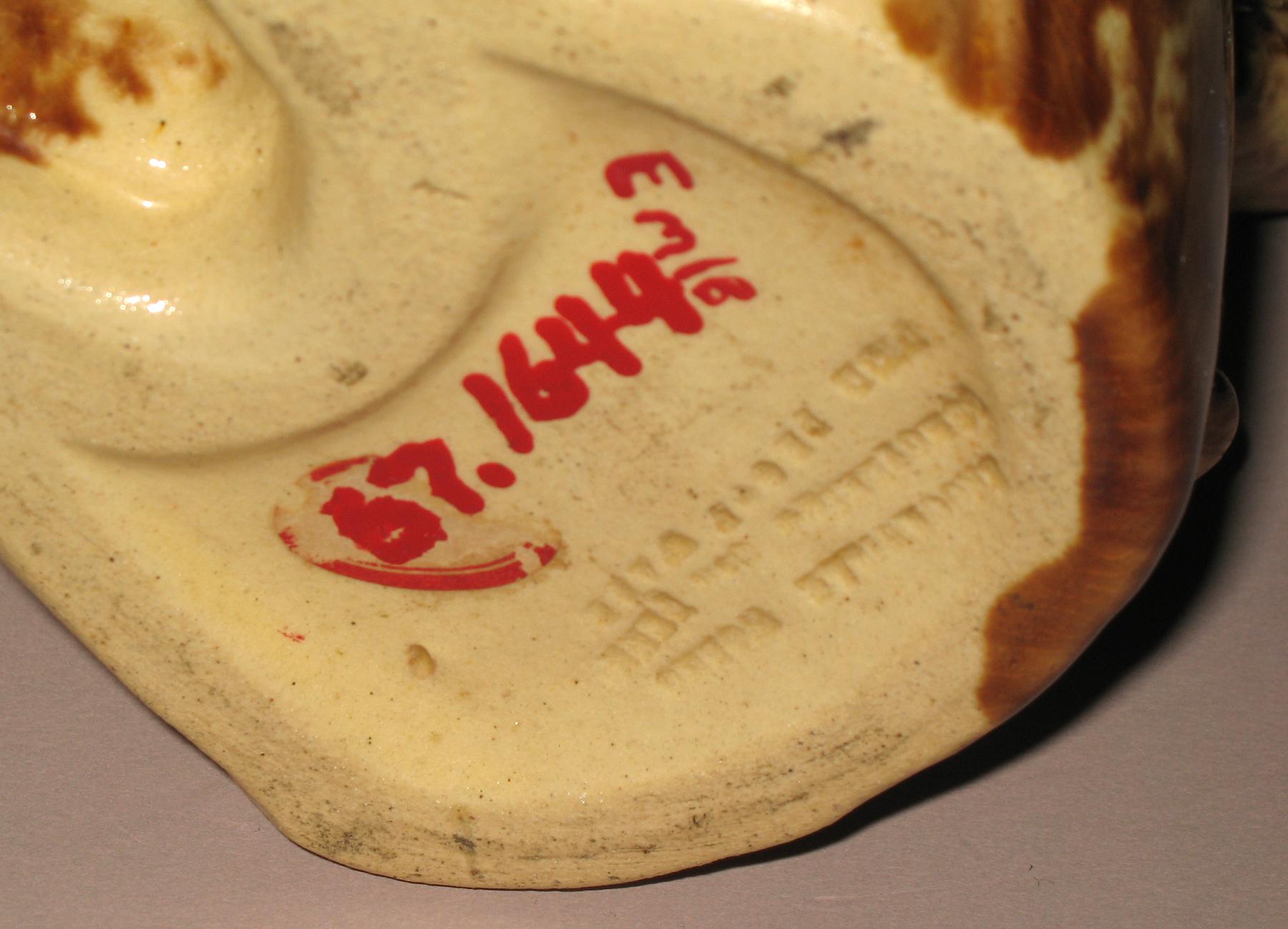 1967.1644 Earthenware man shaped jug or pitcher (bottom-mark)
