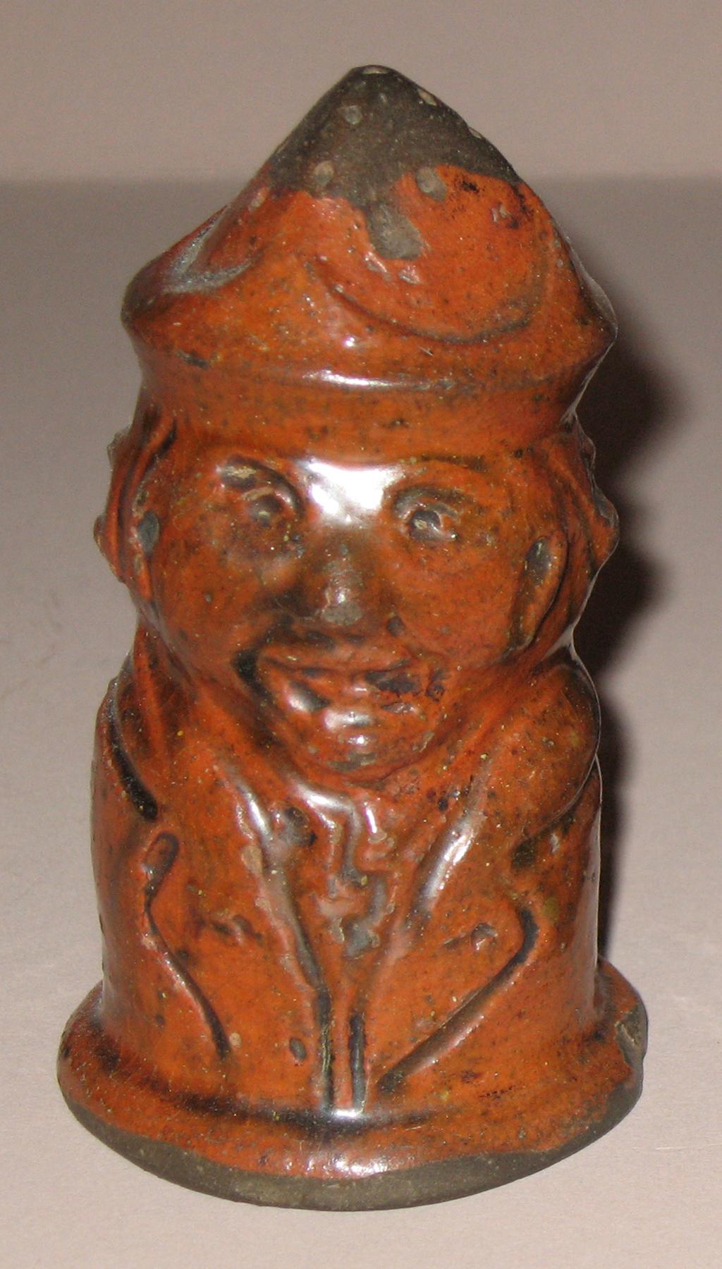 1967.1656 Redware man-shaped caster