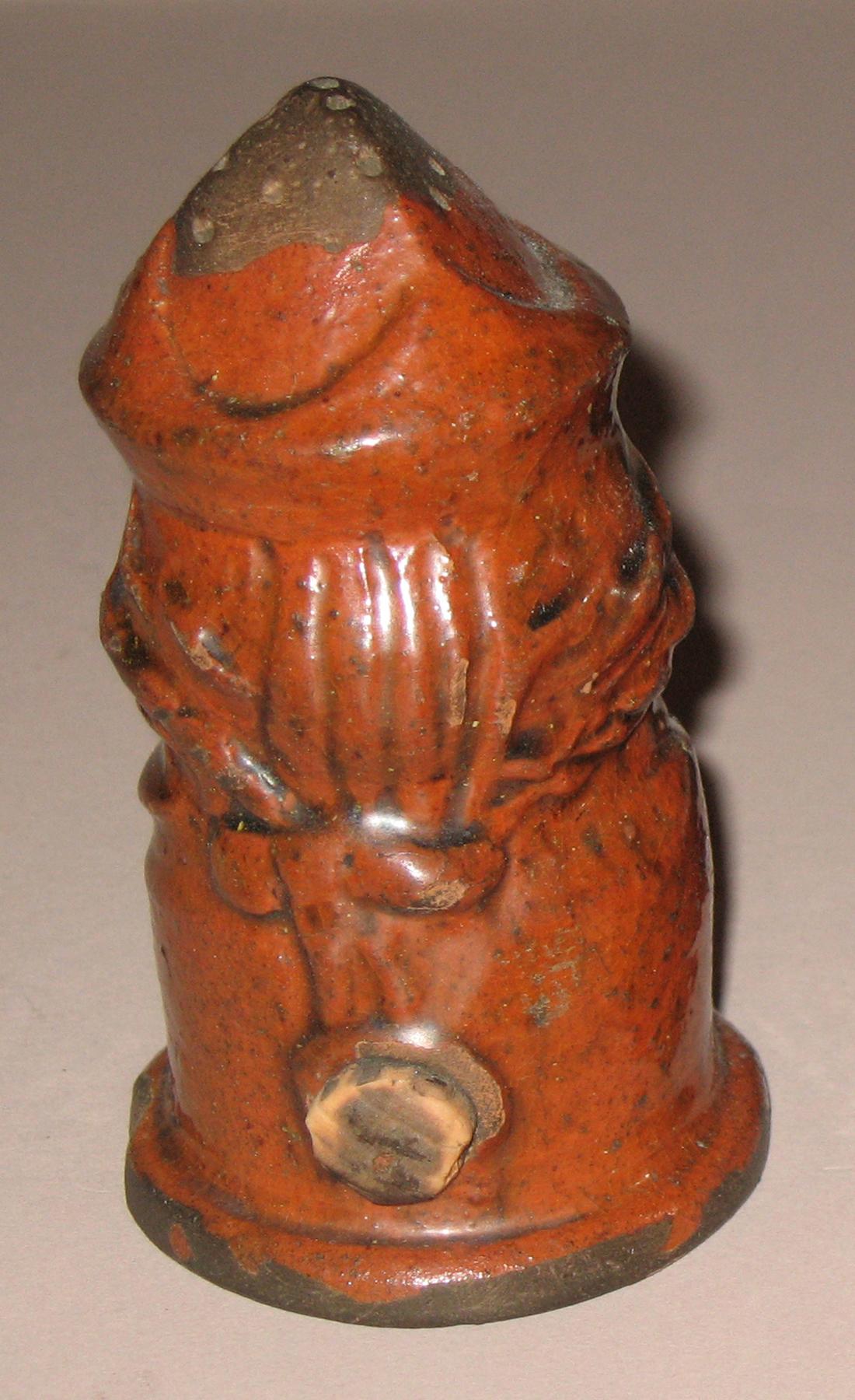 1967.1656 Redware man-shaped caster (back)