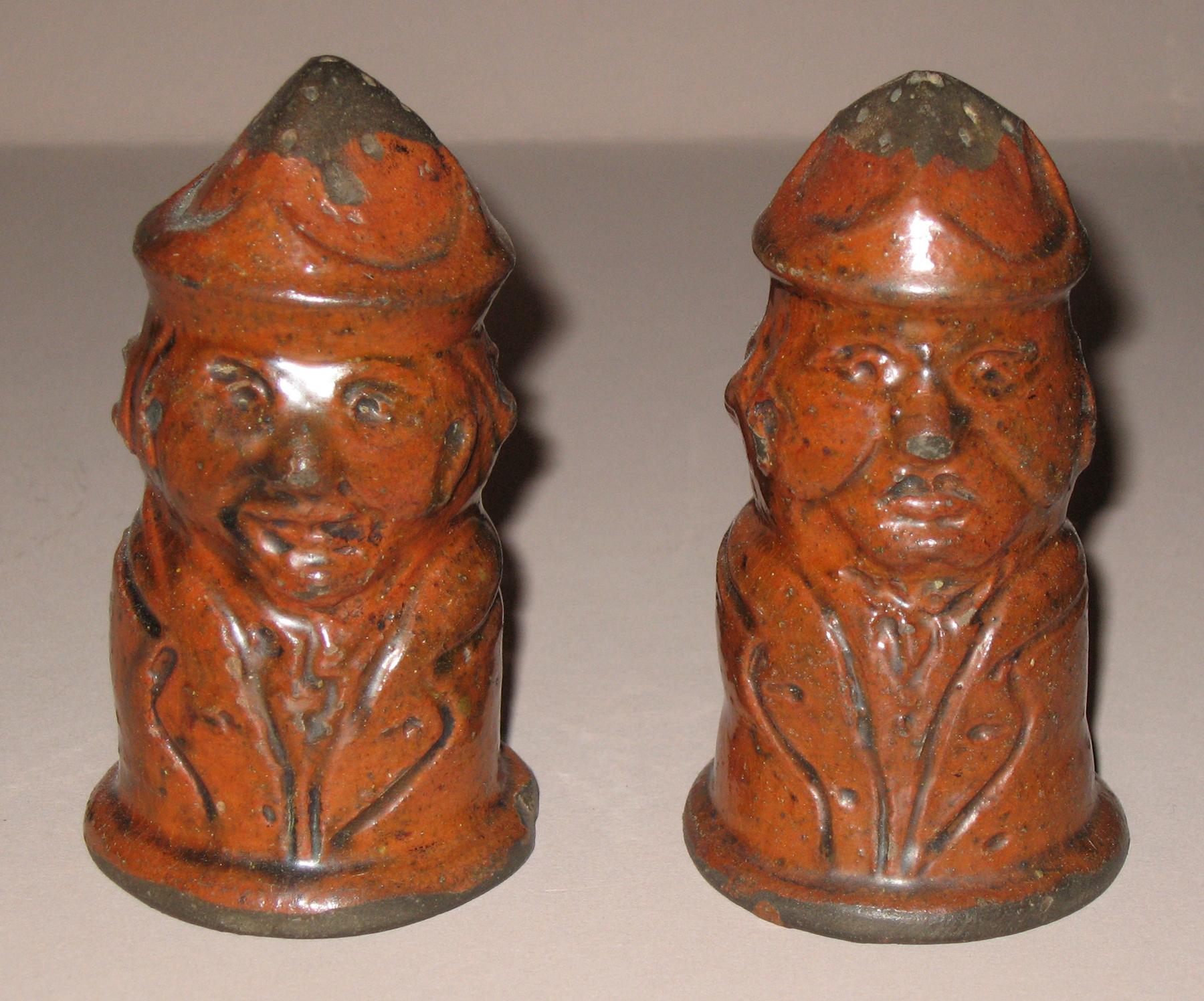 1967.1656, 1967.1568 Redware man-shaped casters (back)