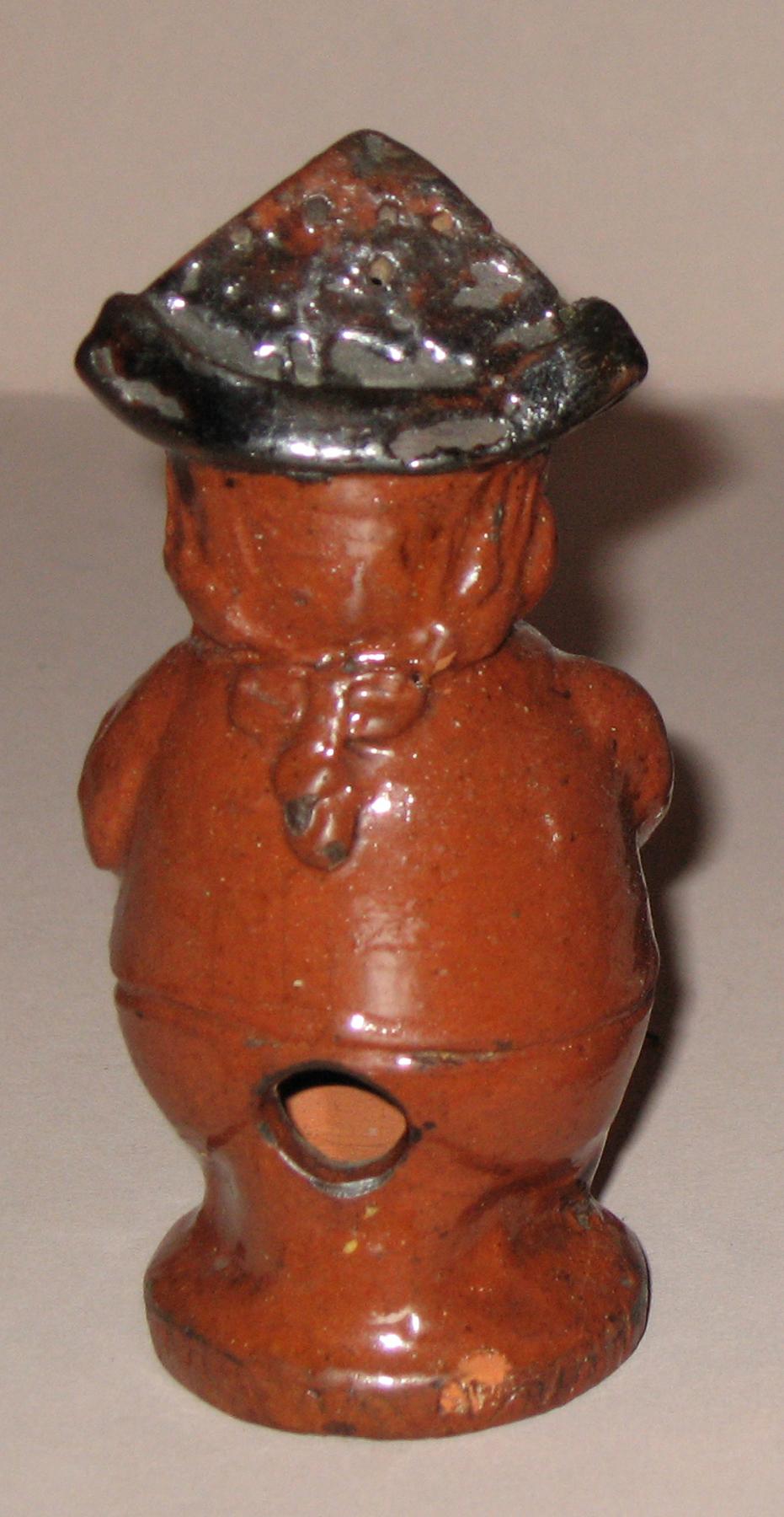 1967.1564 Redware man-shaped caster (back)