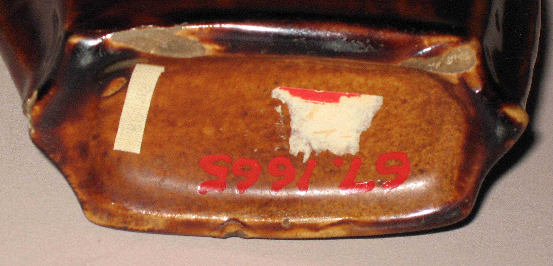 1967.1665 Earthenware eagle flask (bottom)
