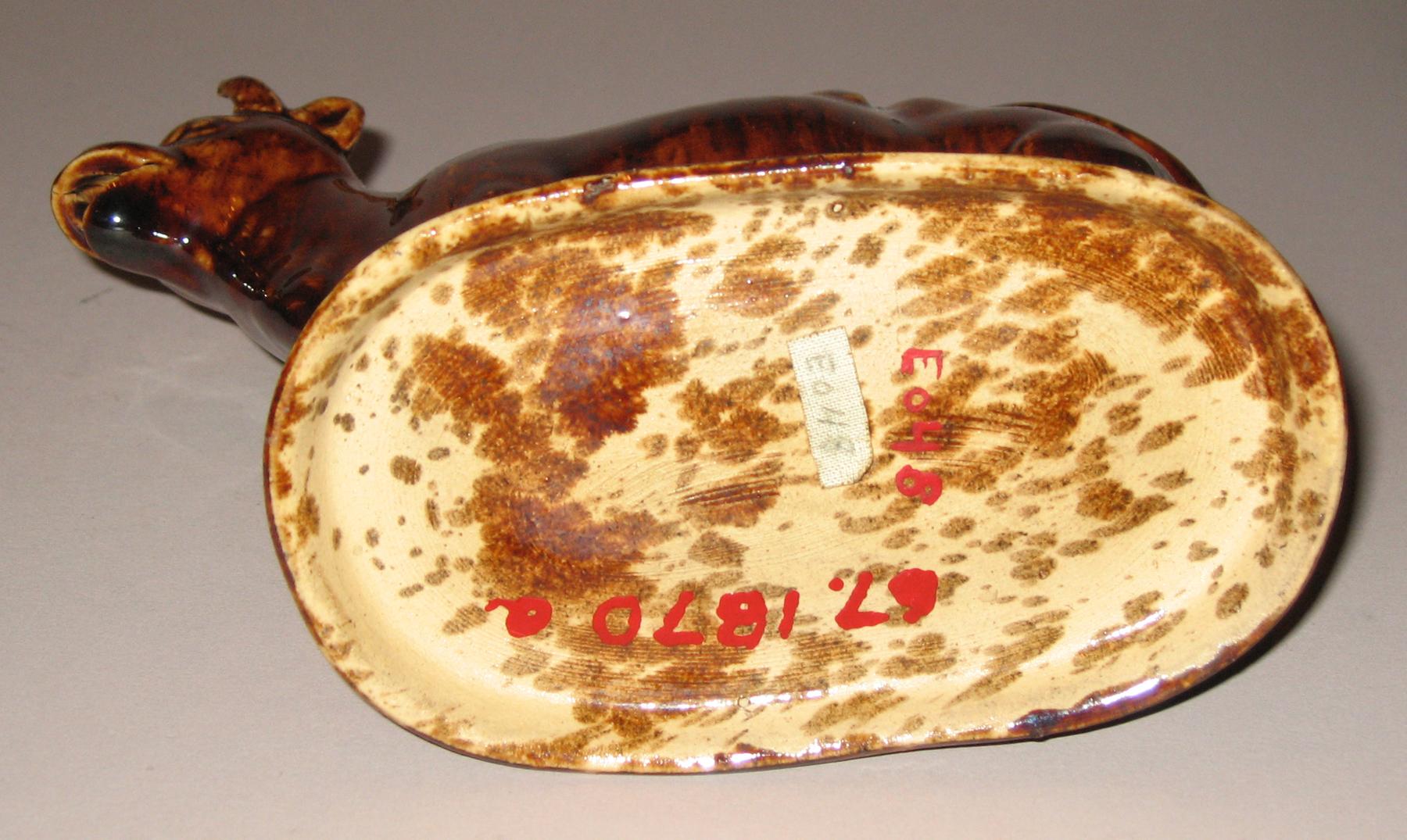 1967.1870 A, B Earthenware cow creamer (bottom)