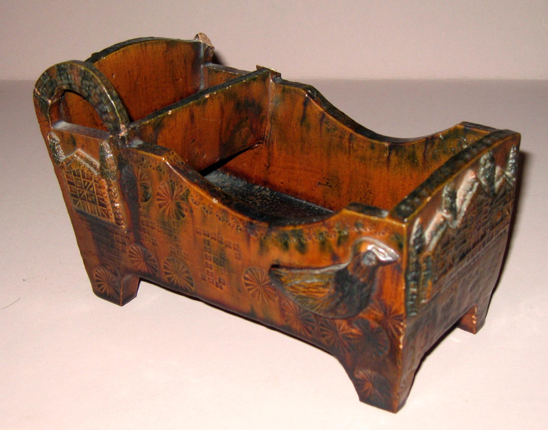 1967.1883 Redware cradle