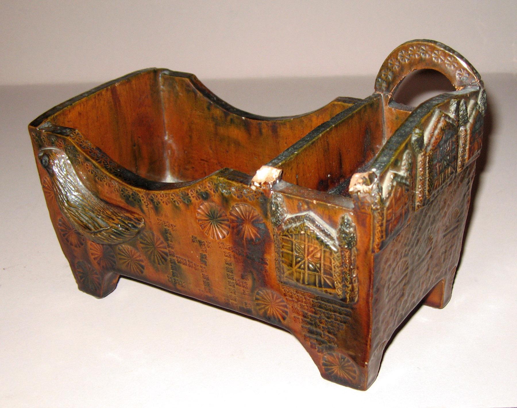 1967.1883 Redware cradle (side 2)