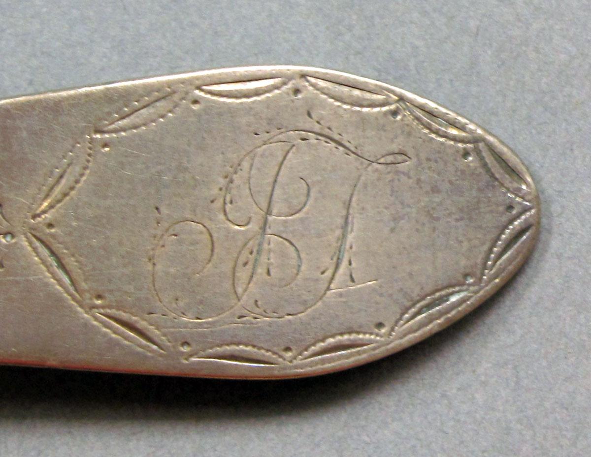 1968.0043 Silver spoon engraving