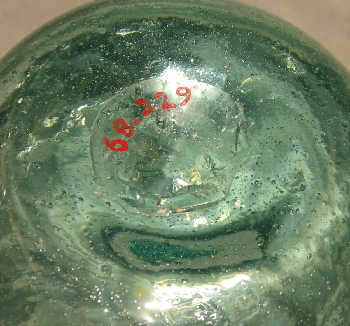 1968.0229 Glass bottle (underside)
