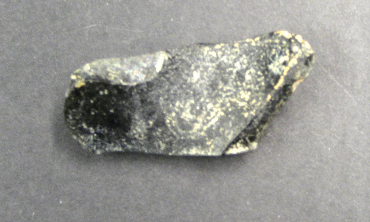 1968.0312.010 Bottle glass fragment (underside)