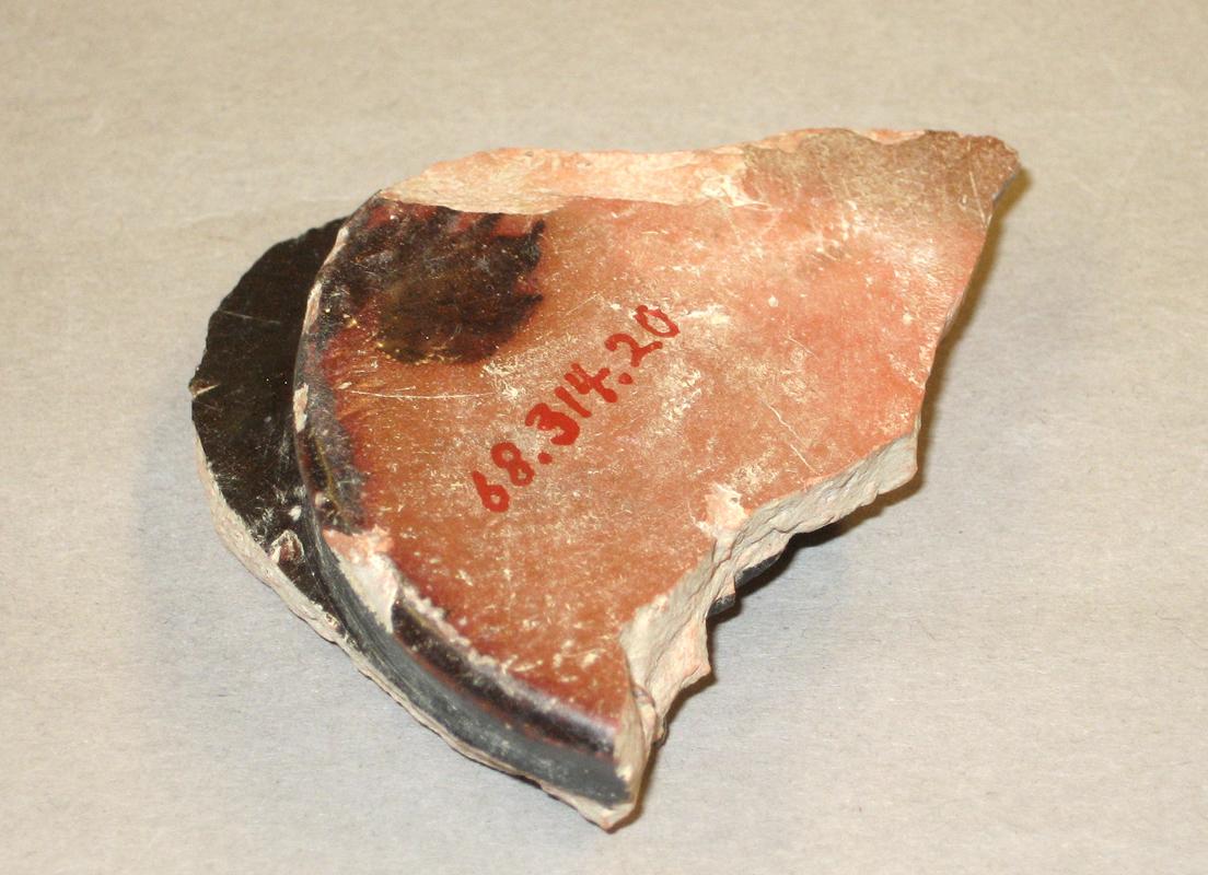 1968.0314.020 Red earthenware (redware) fragment-underside
