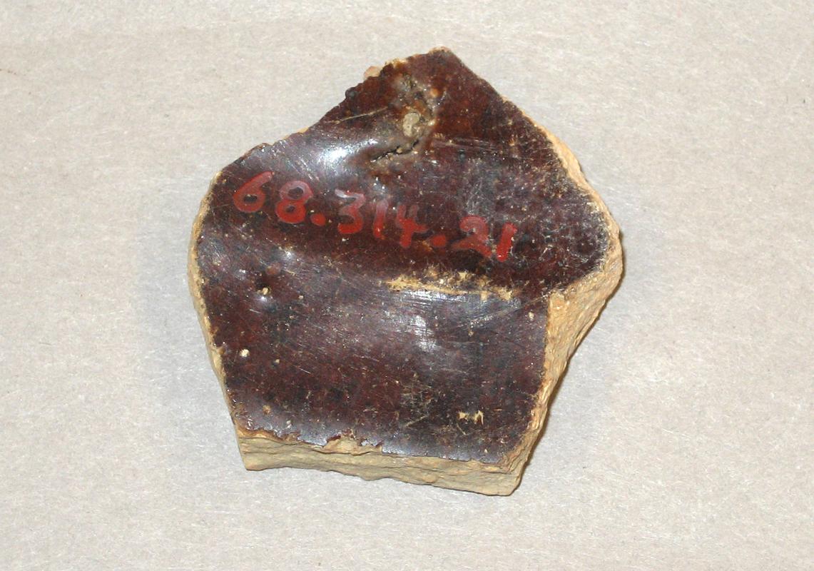 1968.0314.021 Red earthenware (redware) fragment-underside