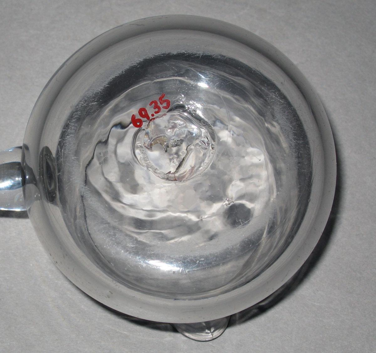 1969.0035 Glass saucepan (underside)