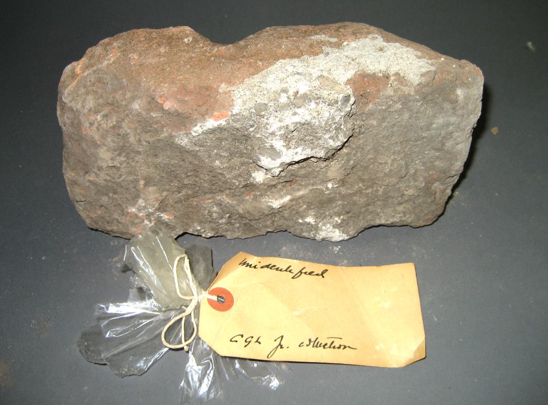 1969.0056.001 Brick and tag