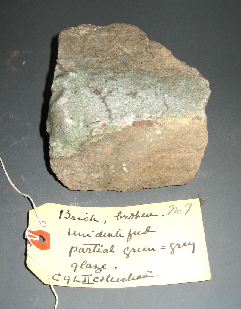 1969.0056.006 Brick fragment (with tag)
