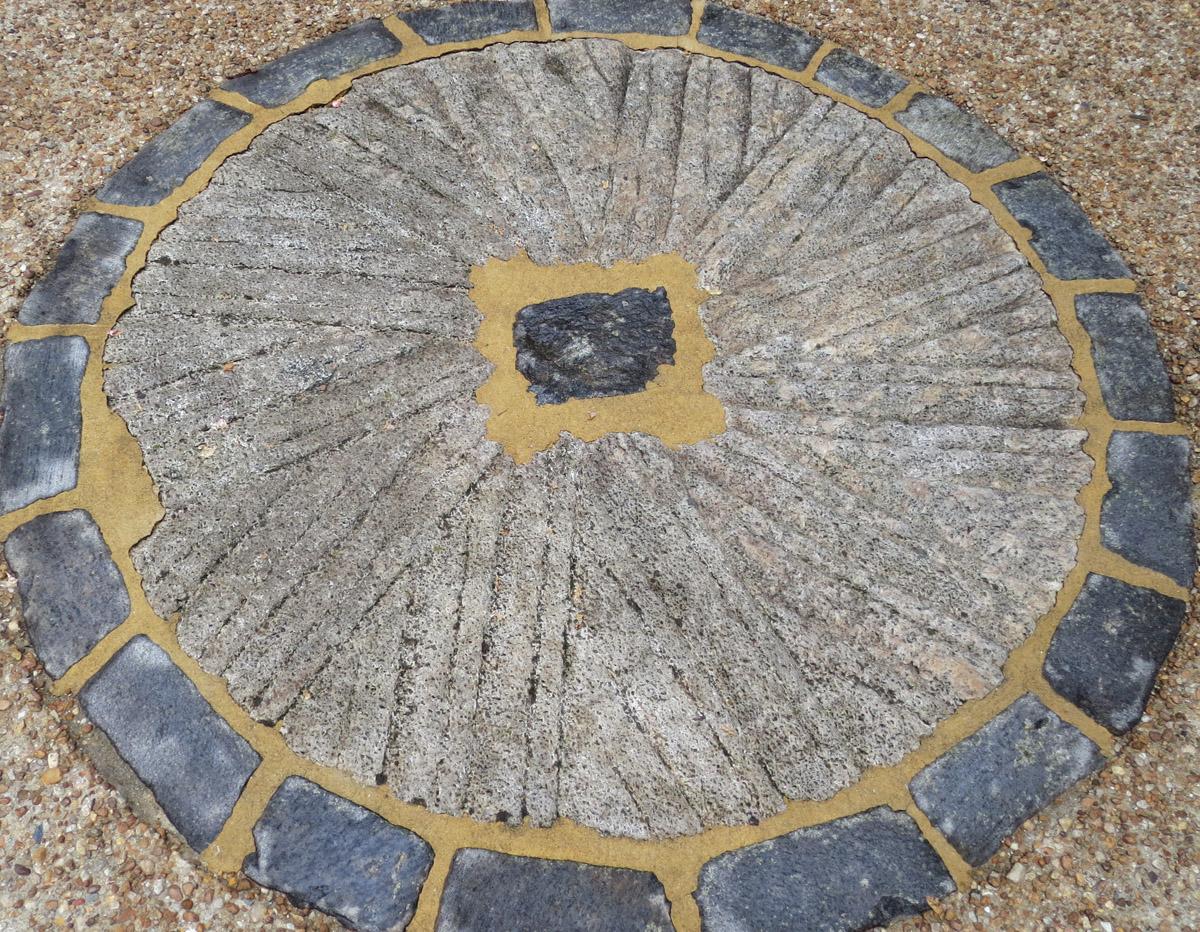 1969.0077.008 millstone in patio