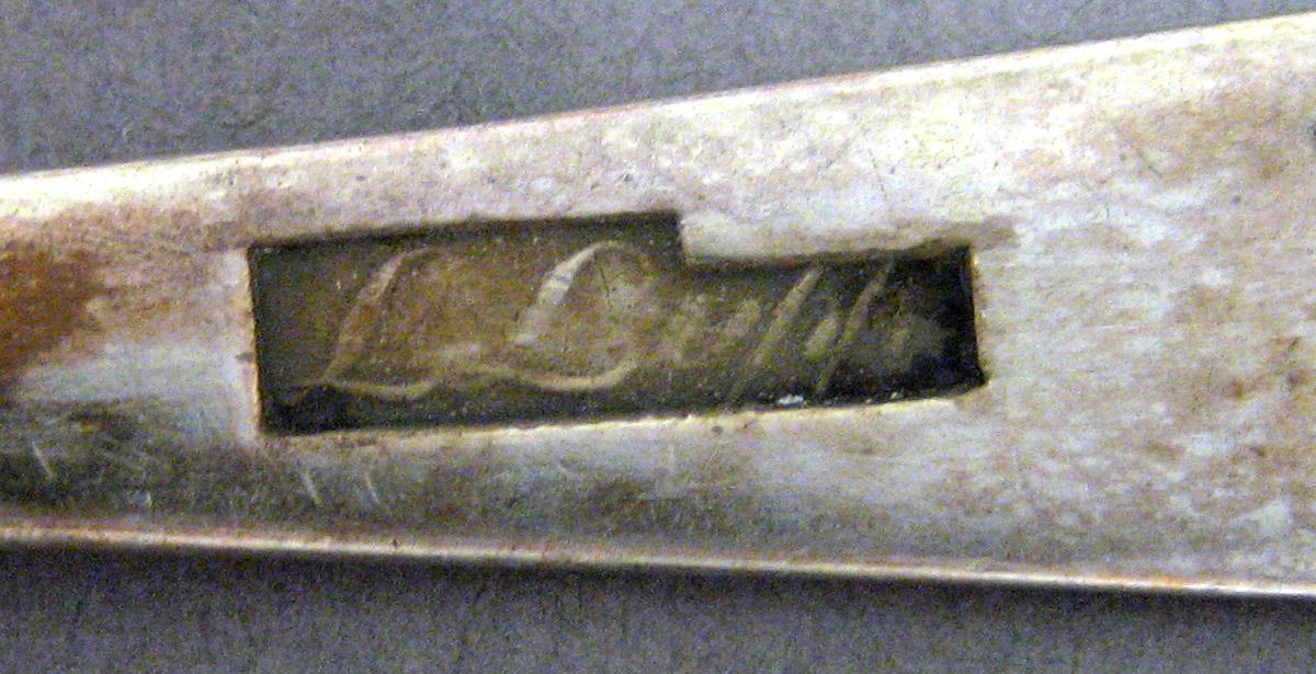 1969.0099 Teaspoon mark