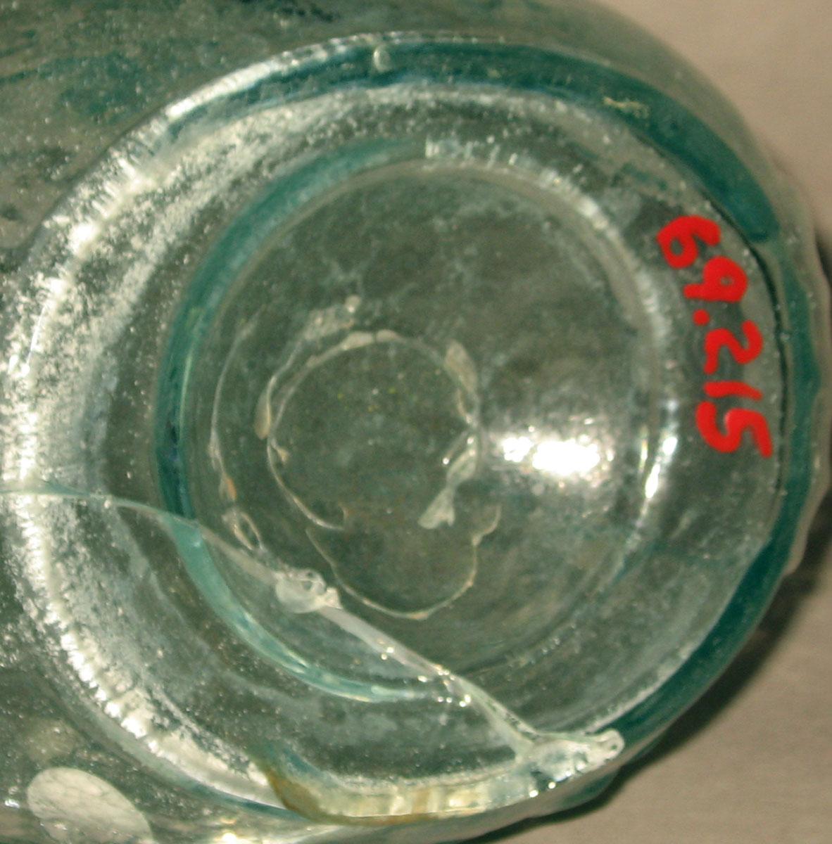 1969.0215 Glass Jenny Lind bottle (underside)