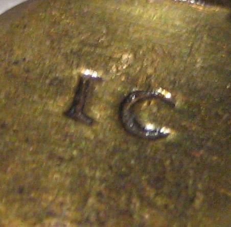 1969.0275.002 Candlestick and douter (mark)