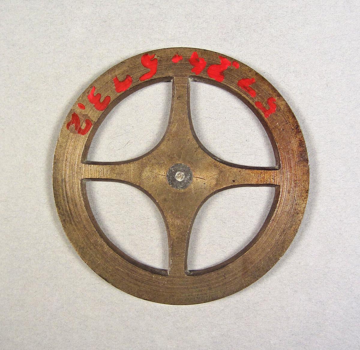 1957.0026.573.002, Clock wheel template, side 1