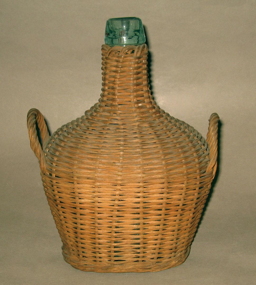 1969.0325.002 Glass bottle in wicker case