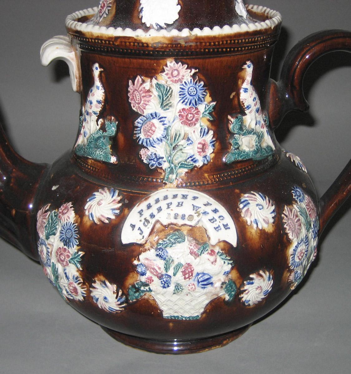 1969.0387 Earthenware teapot detail side 1