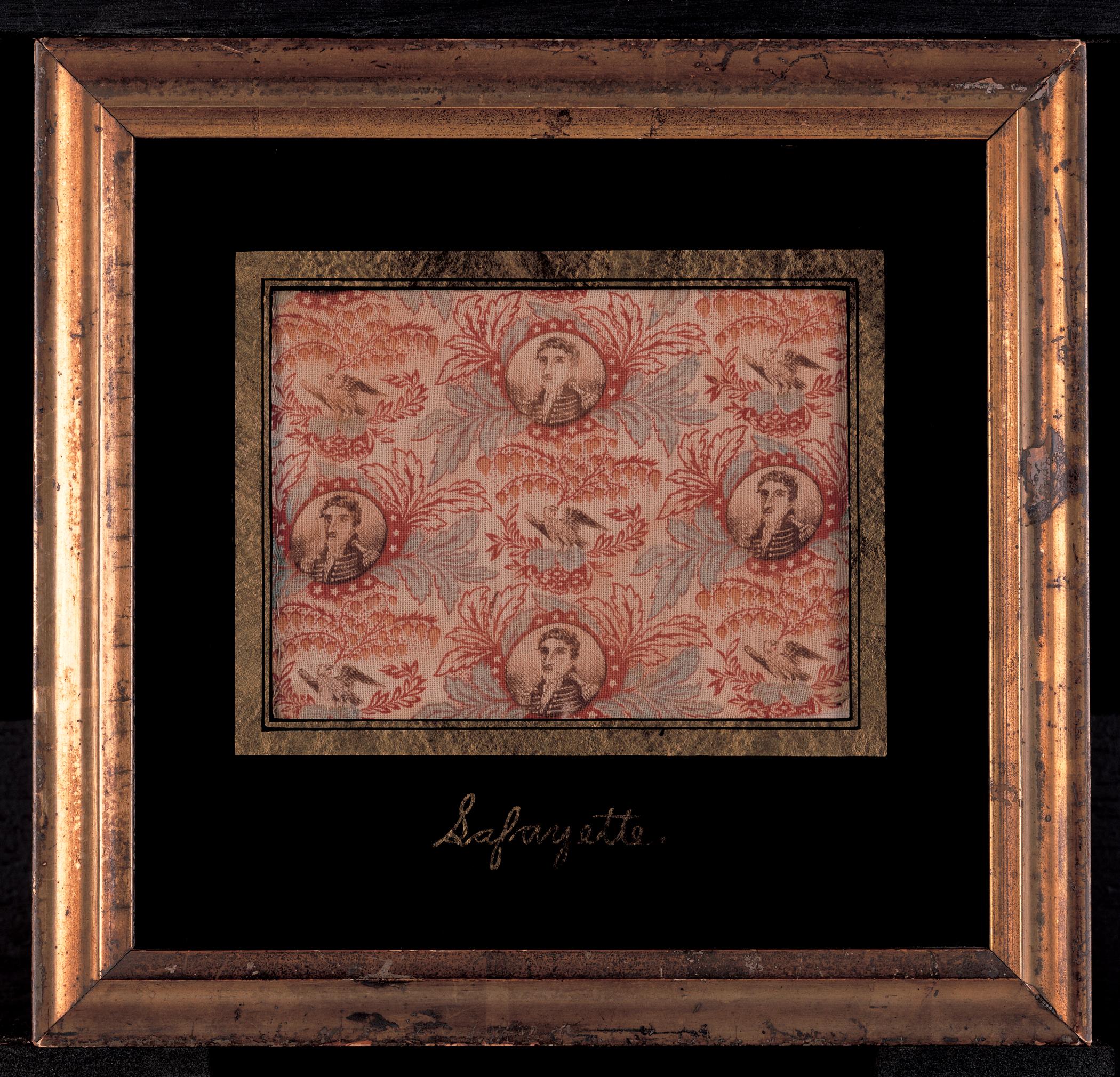 1969.0444 A, B Textile fragment in frame