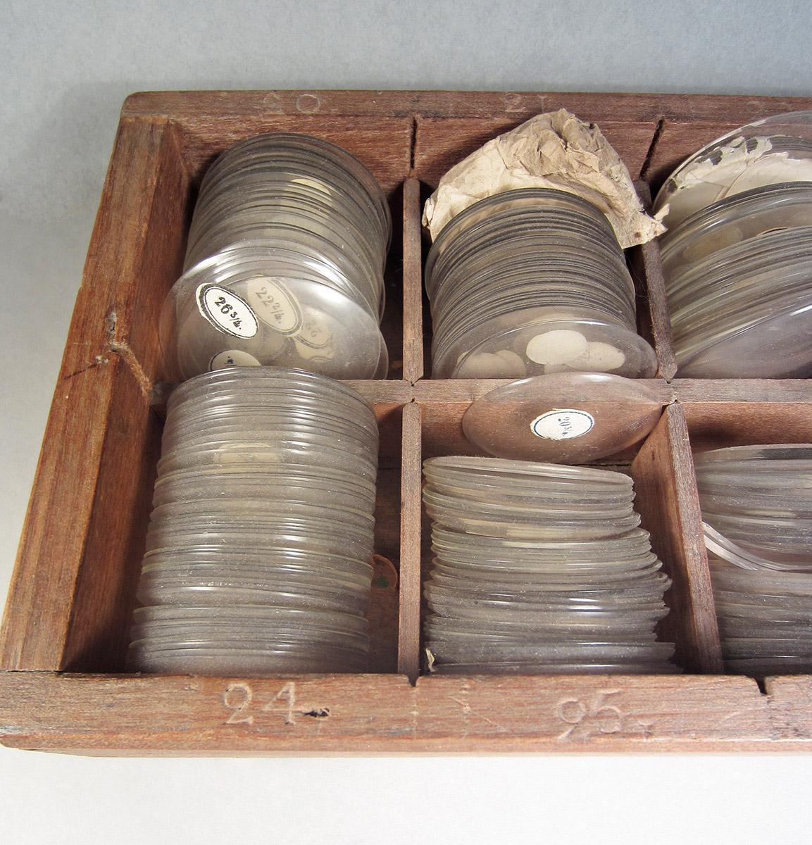 1957.0026.607, Box of watch crystals, crystals detail
