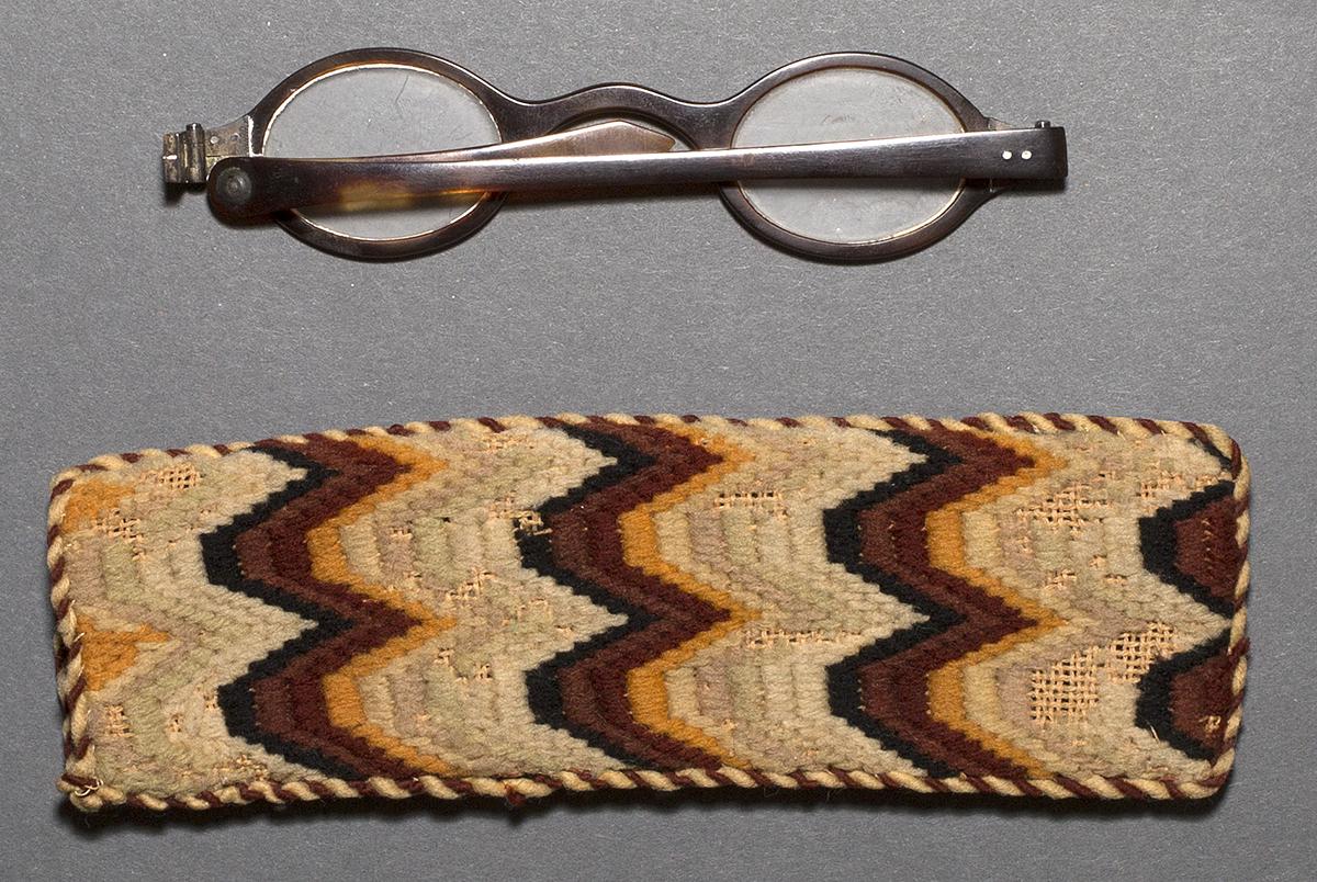 1969.0663 Spectacles and 1969.0664 Spectacles Case, Verso