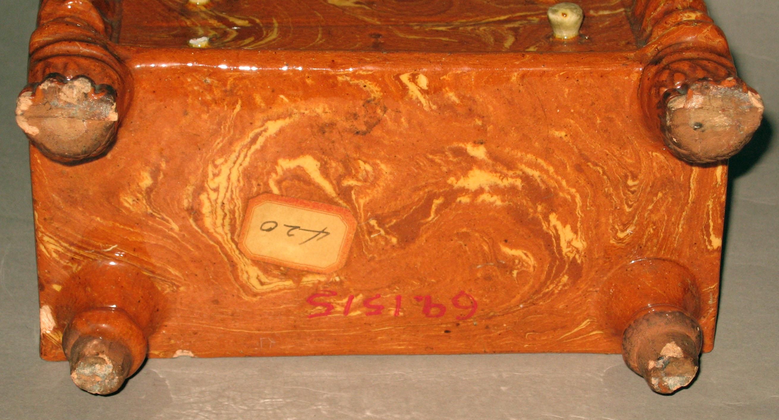 1969.1515 Agateware coin bank (underside)