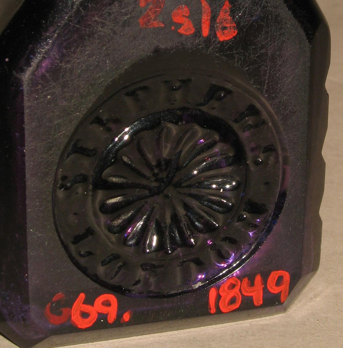 1969.1849 Glass inkwell (underside)