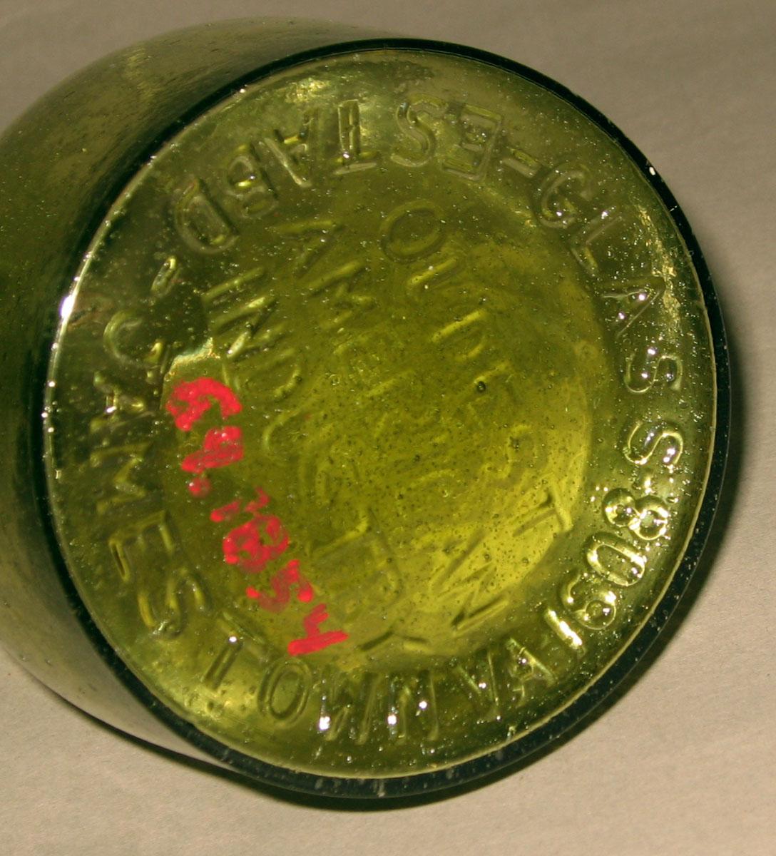 1969.1854 Glass bottle (underside)
