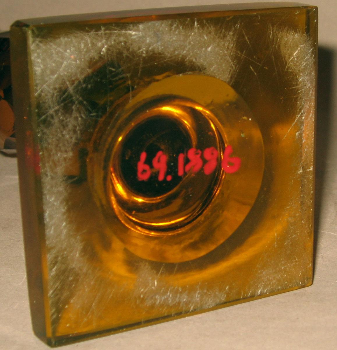 1969.1886 Glass candlestick (underside)