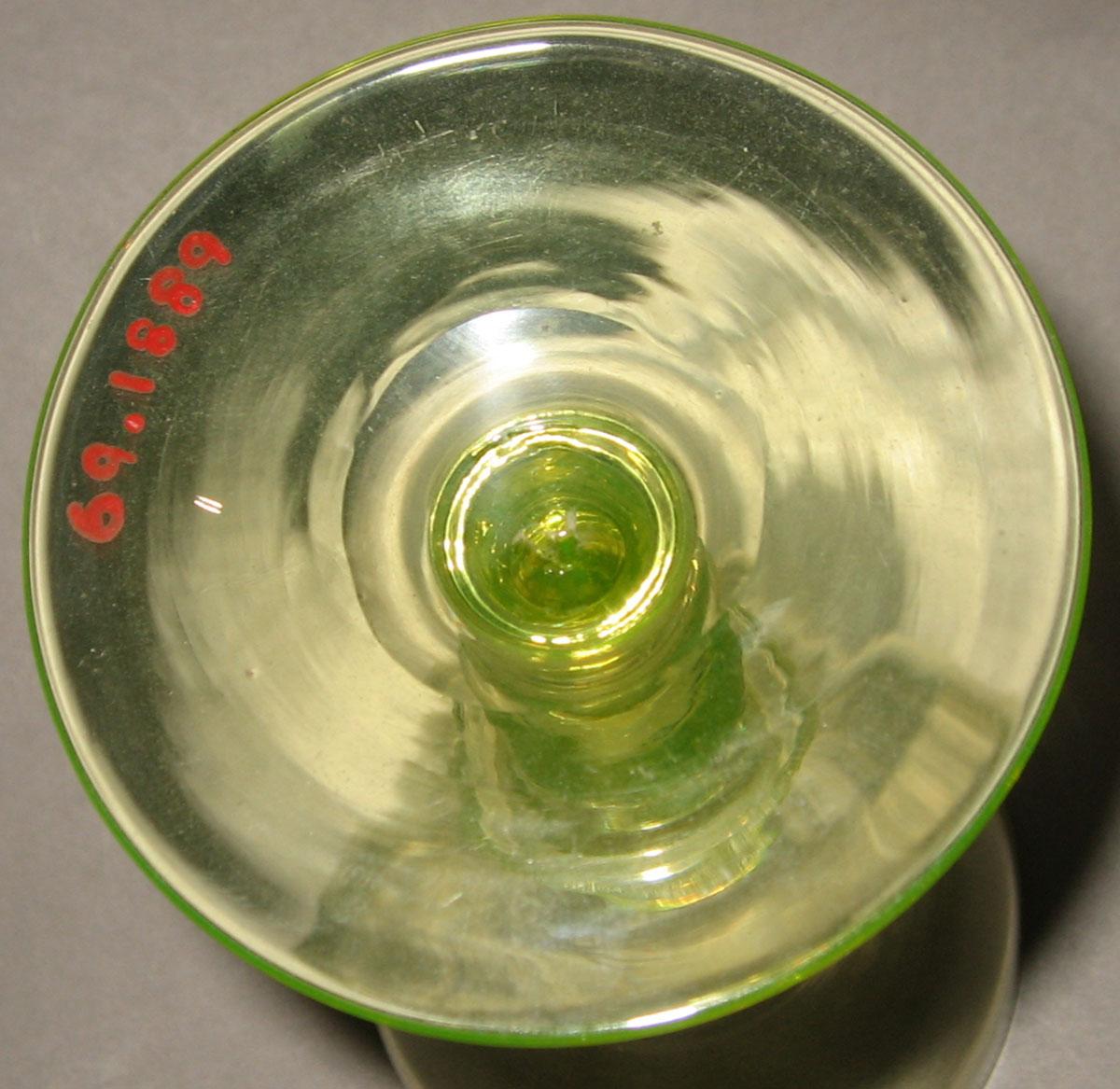 1969.1889 Yellow glass champagne glass (underside)