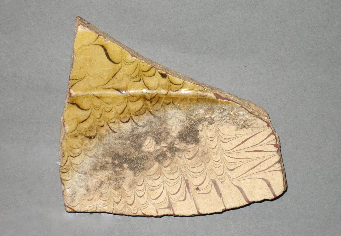 1969.1700 Ceramic fragment side1