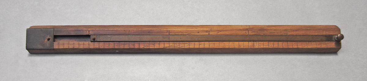 1957.071.012, Marking gauge, side 1