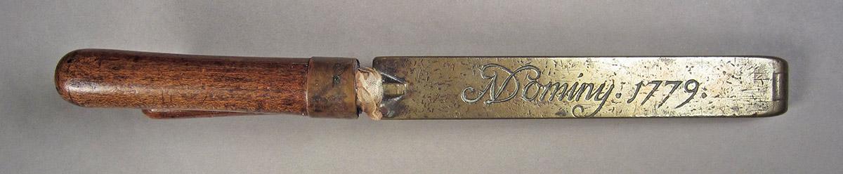 1957.0084.001, Shot mold, side 1
