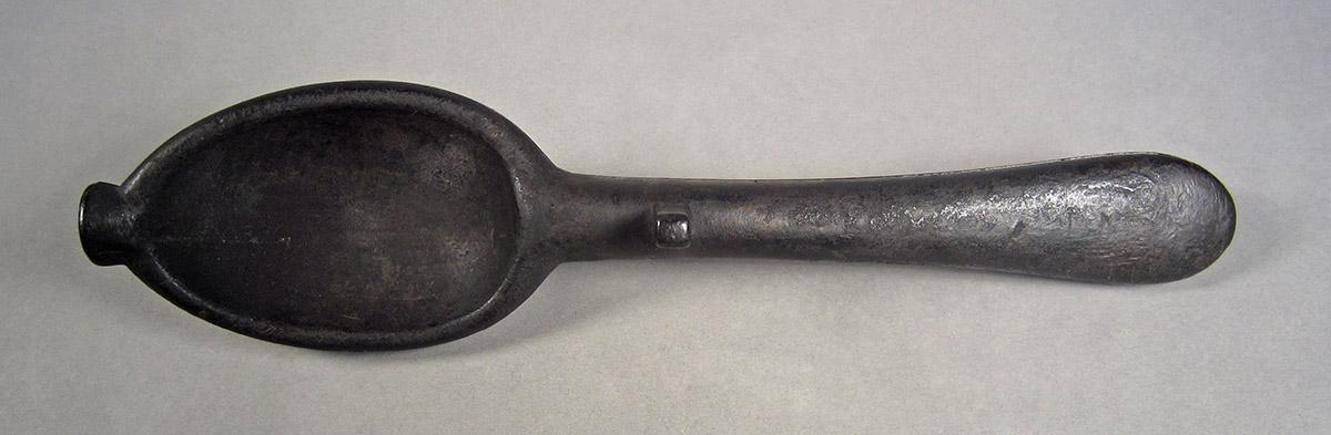 1957.0084.004, Spoon mold, side 1