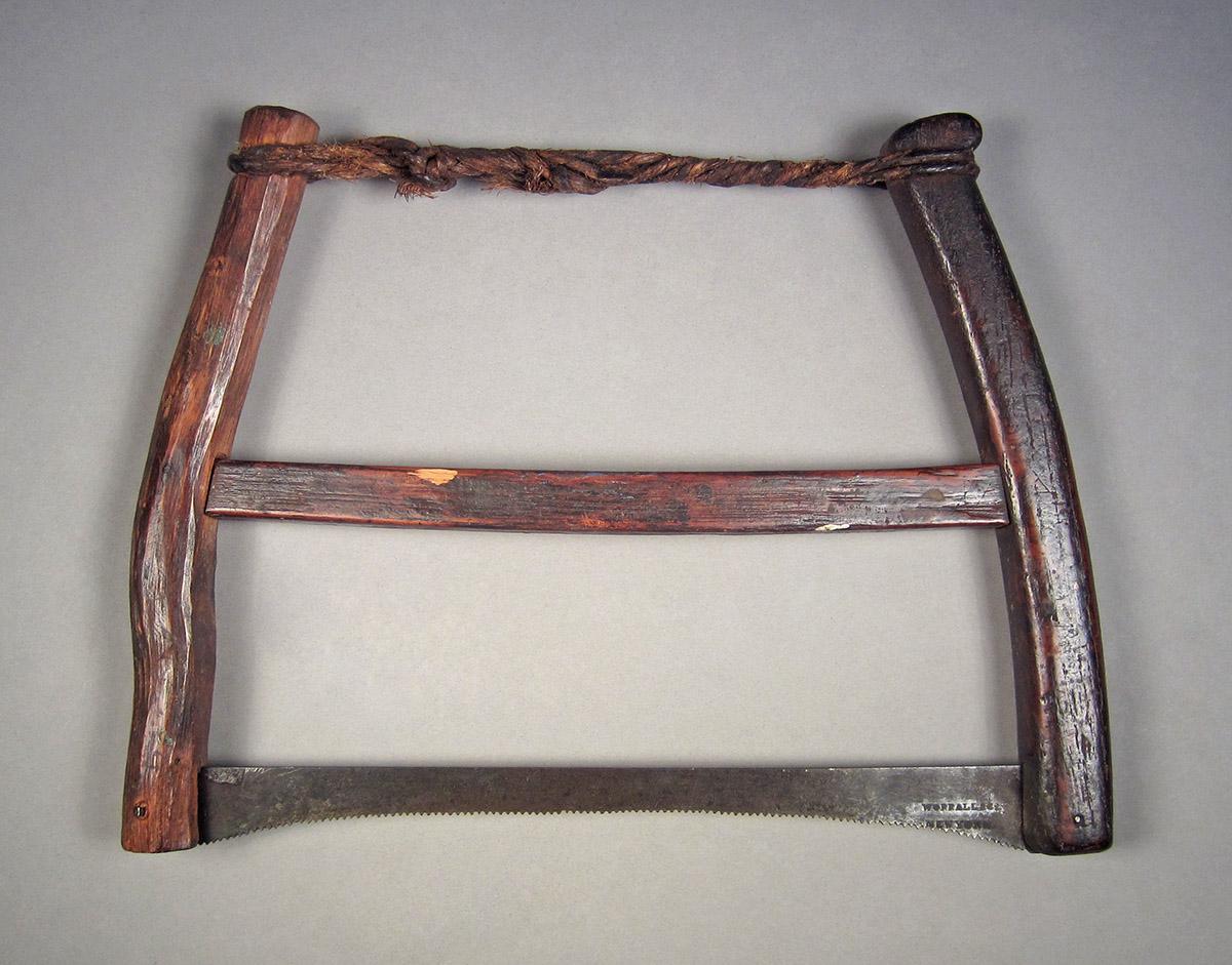 1957.0084.007, Frame saw, side 1