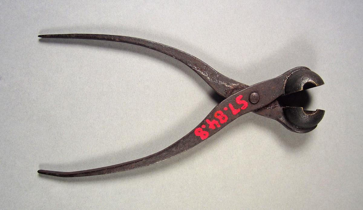 1957.0084.008, Bullet mold, side 1