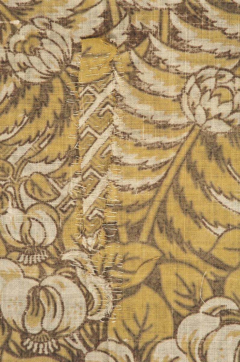 1969.3092 Textile, printed, reverse, detail 1, before conservation treatment