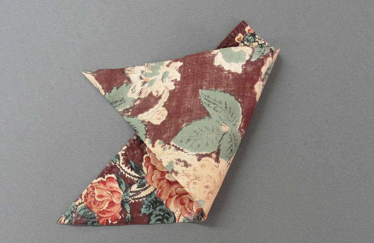 1969.3188.002 Textile, printed folded corner