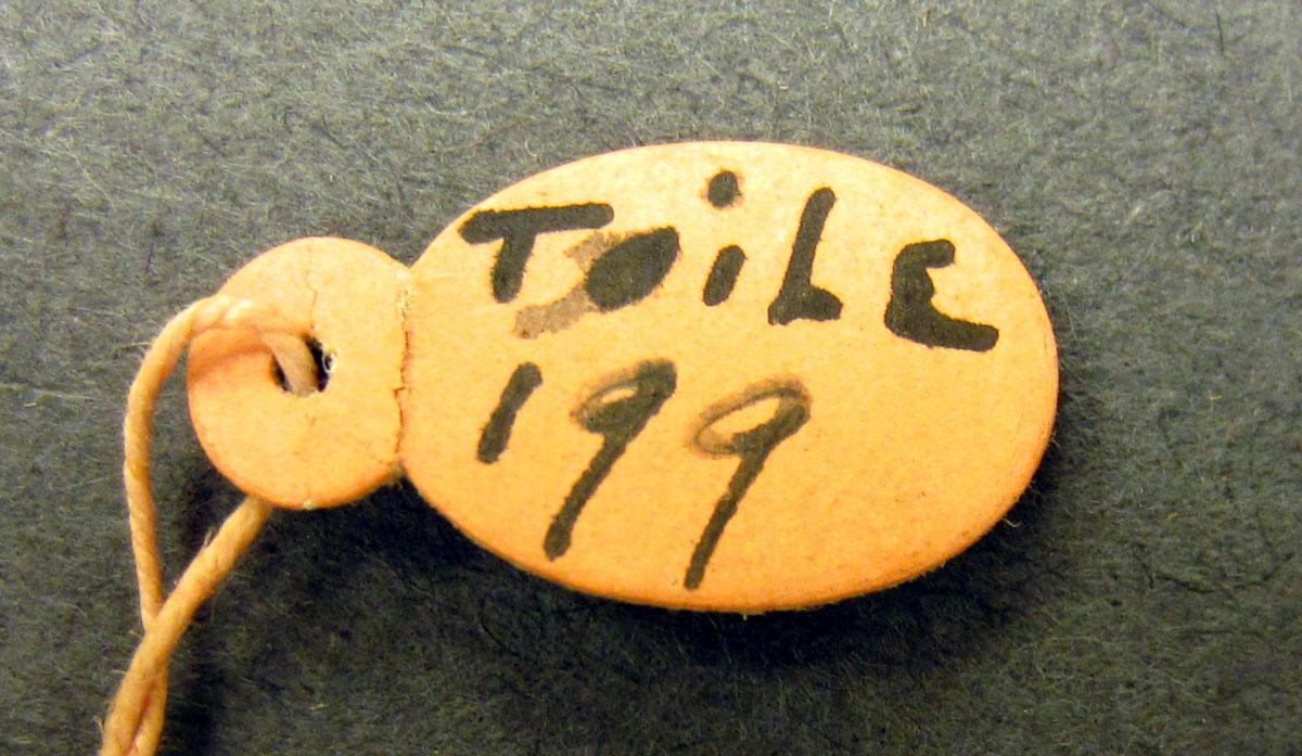 1969.3269.002 Textile, printed tag underside