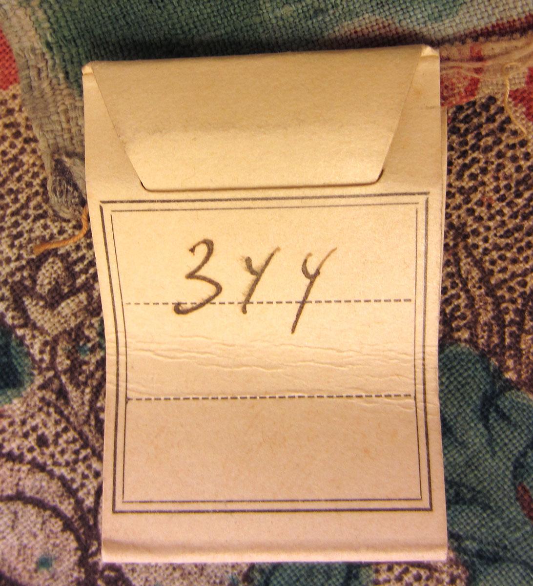 1969.3325.001 Textile, printed label underside