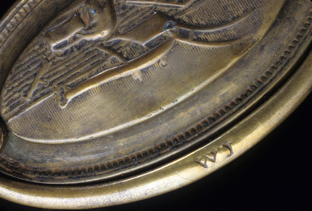 1969.3612 Drawer handle plate, maker's mark