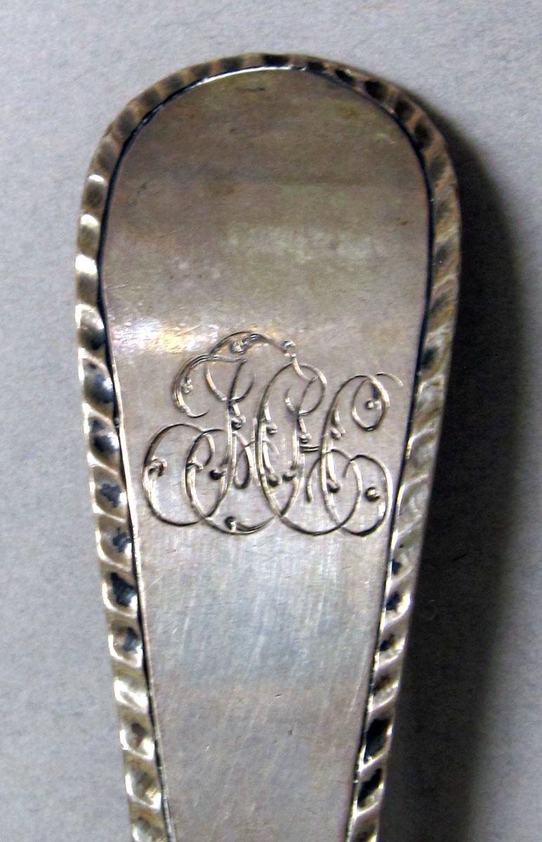 1957.0123 Silver spoon engraving