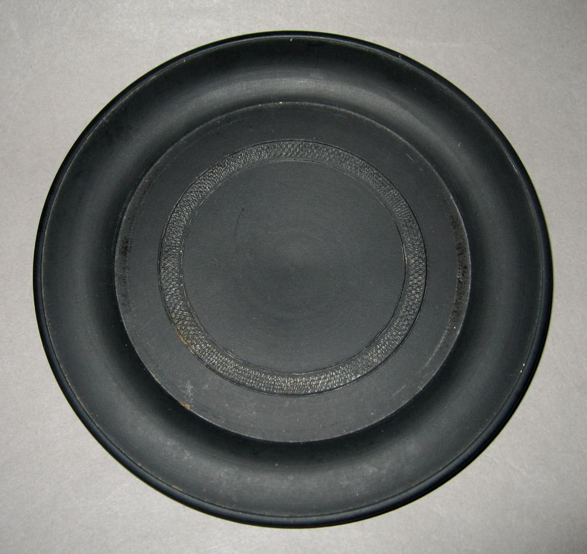 1956.0126.007 C Black basalt plate