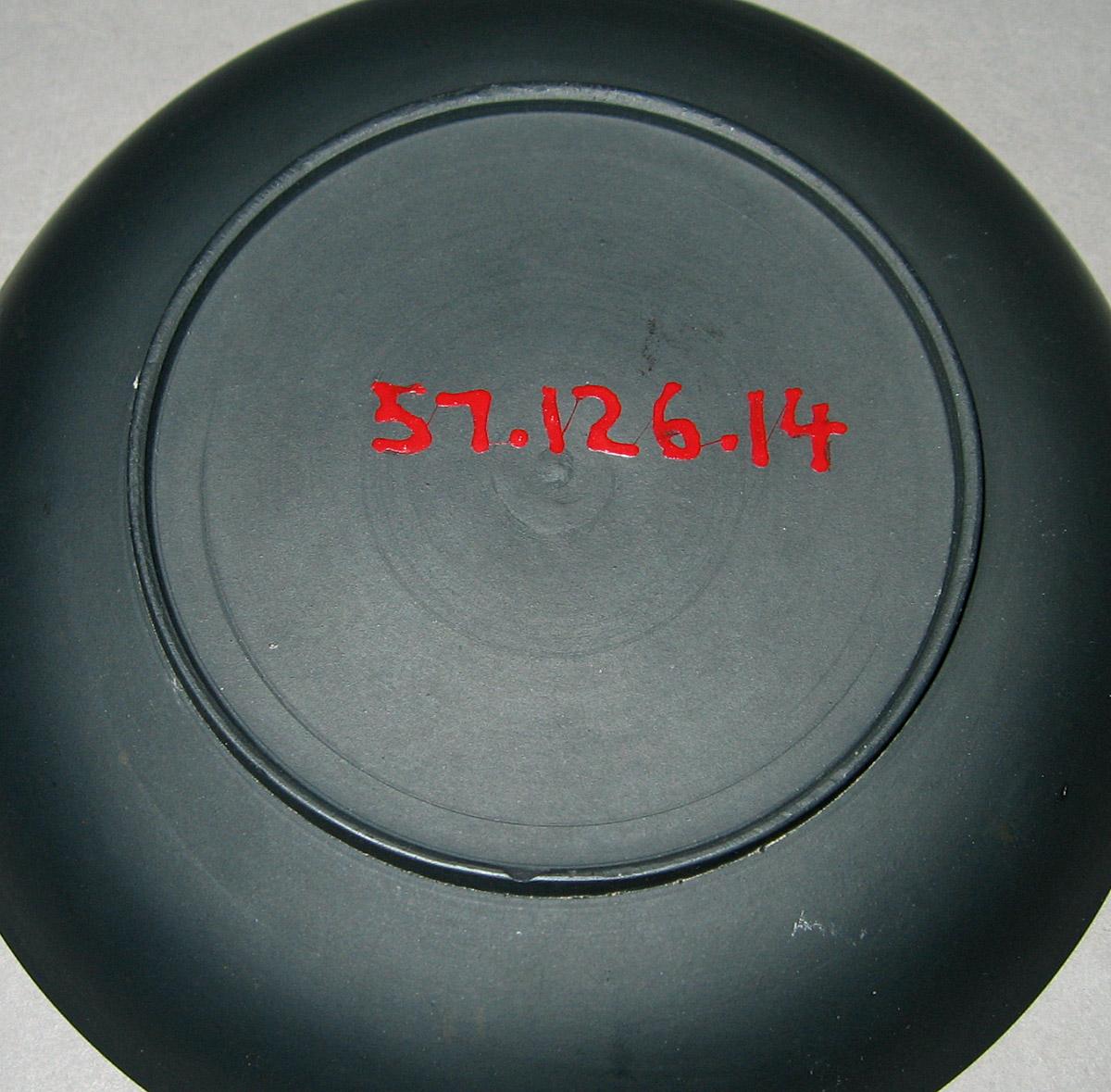 1957.0126.014 Black basalt saucer (underside)