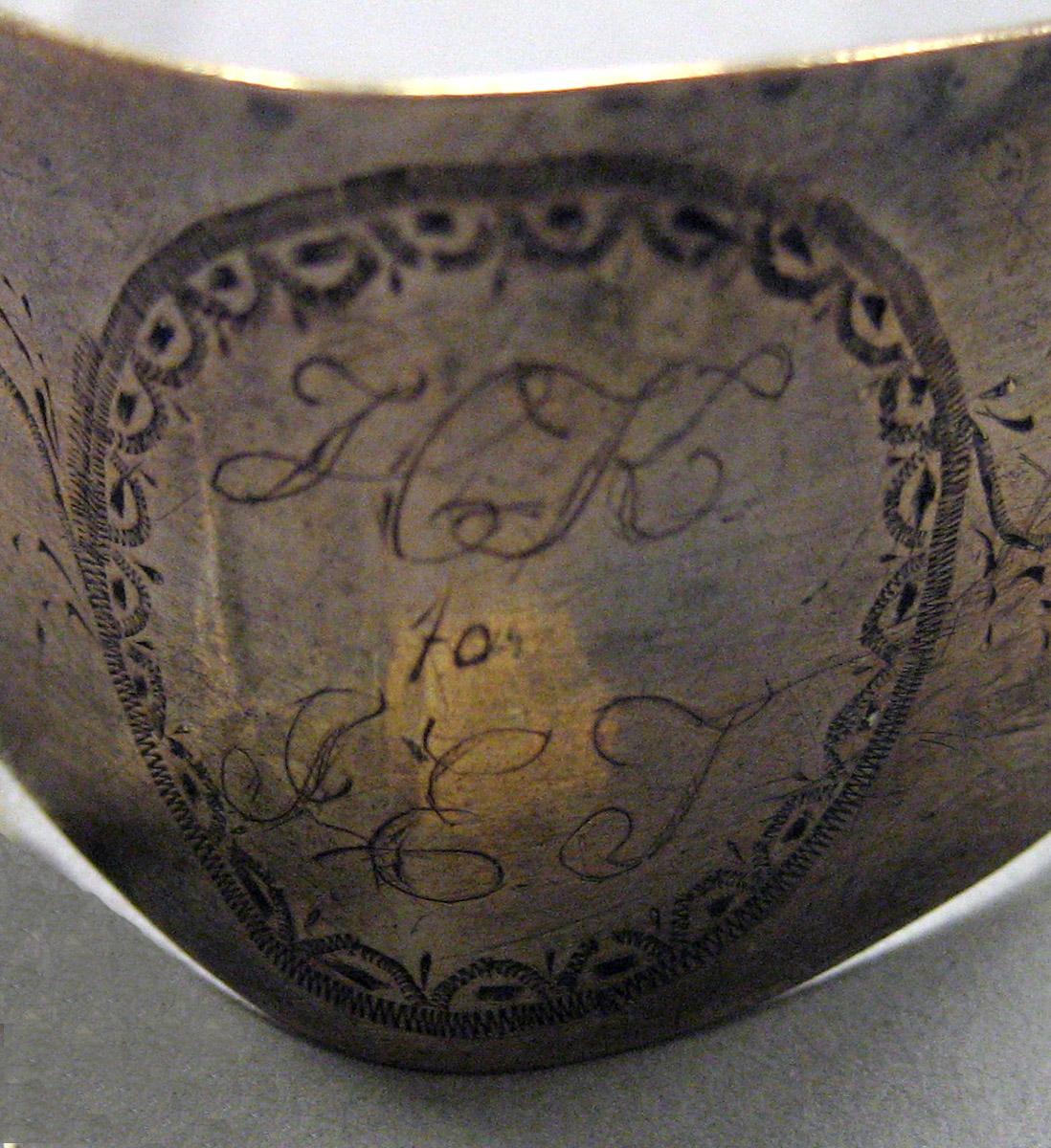 1970.0027 Silver Tongs engraving