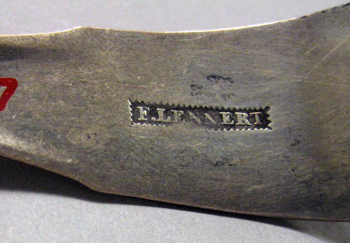 1970.0027 Silver Tongs mark