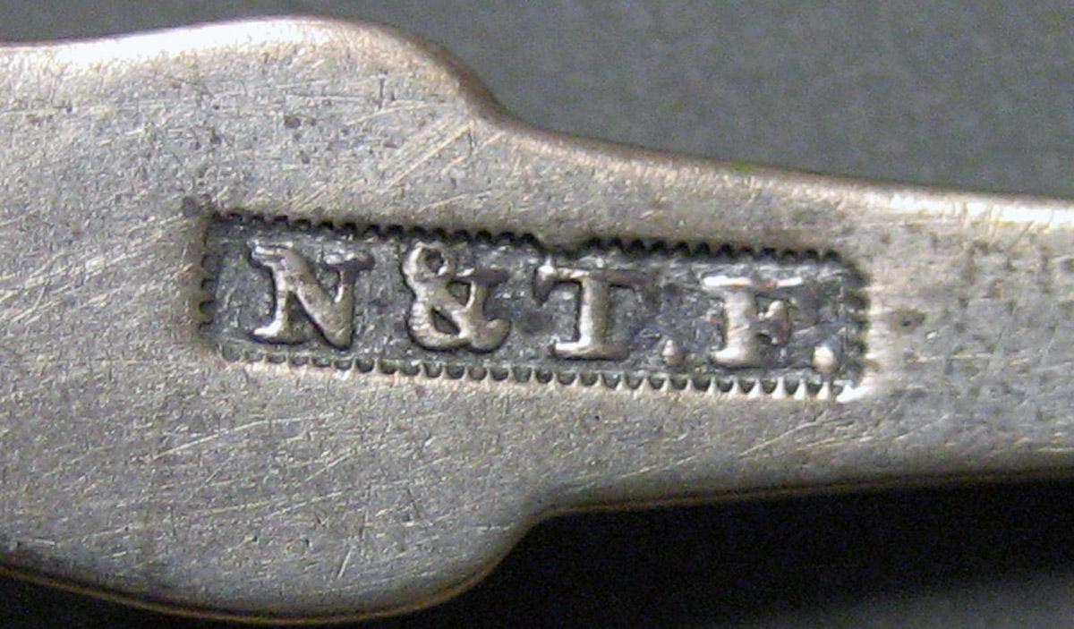 1970.0154 Teaspoon mark
